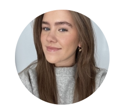 Jane is a Legacy Promotions Assistant at Macmillan. In her headshot, she is seen wearing a grey jumper. She has long dark hair.