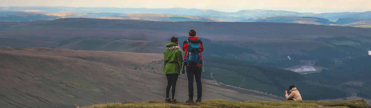 A couple of people at the top of Pen-y-Fan
