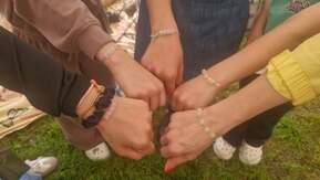 Hands held out together.