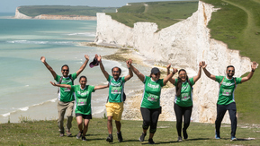 Mighty Hike participants on the South Coast cliffs overlooking the sea.