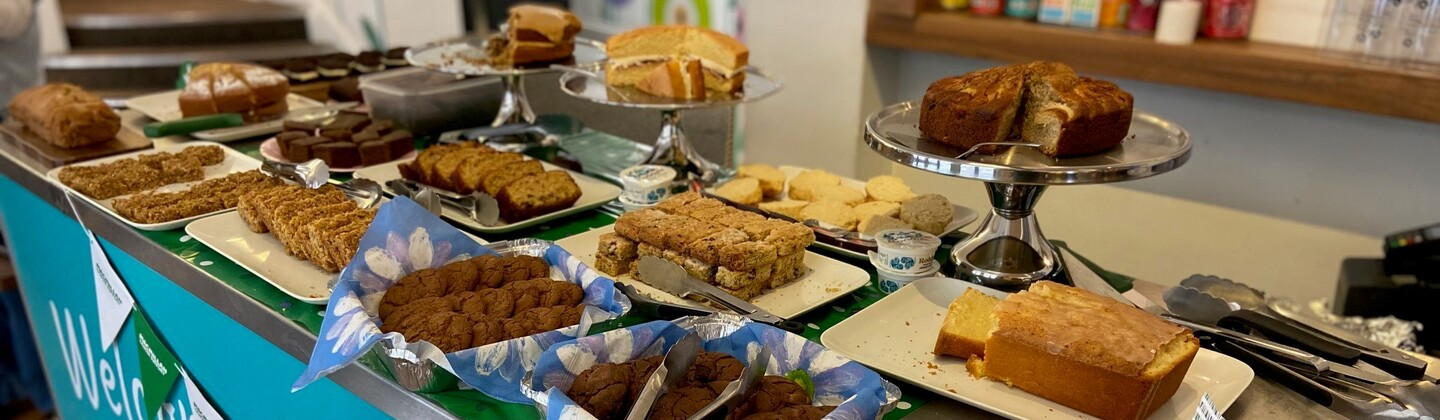 A table spread at the Oxford Playhouse's Coffee Morning. They are different delectable treats spread across the tables including cakes, tray bakes and more.