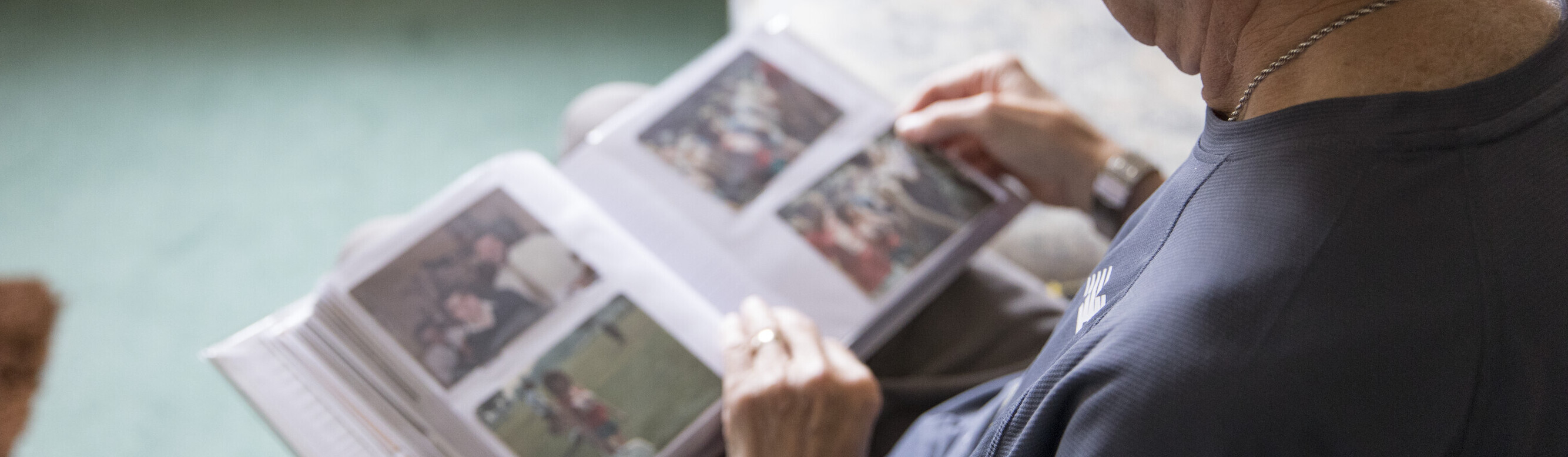 Trevor looking at a photo album