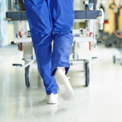 Hospital employee pushing a trolley