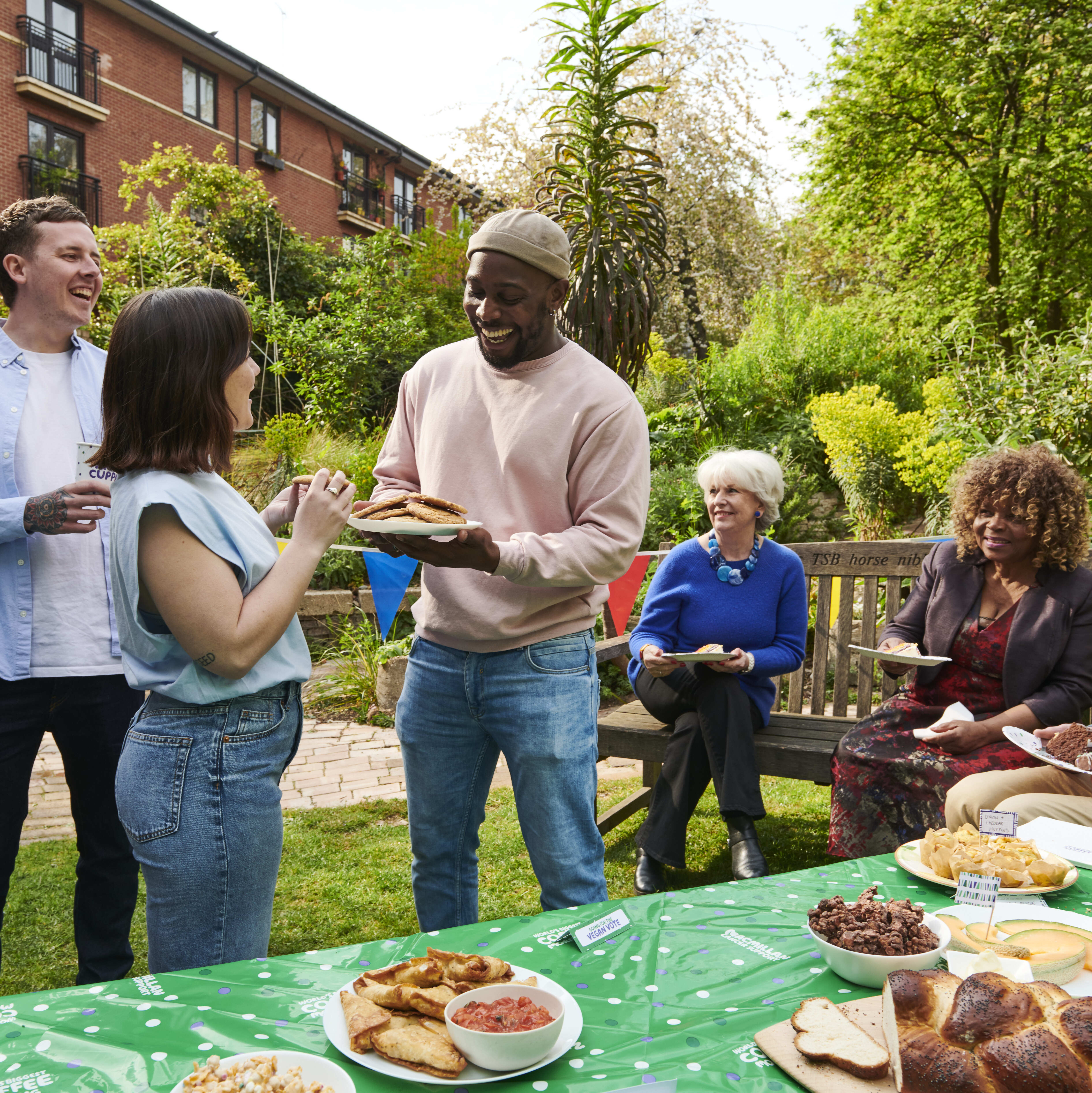A group of people at a coffee morning outside