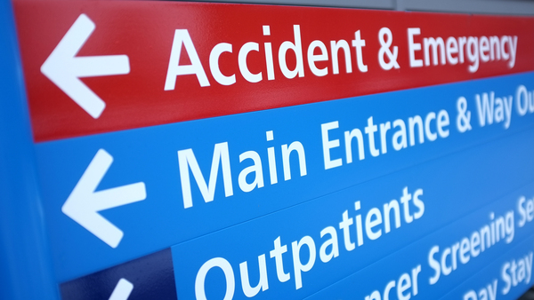 An A&E sign showing which departments are in which direction