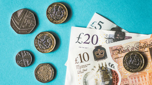 Coins and notes on a blue background