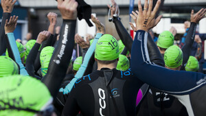 Swimmers in wetsuits