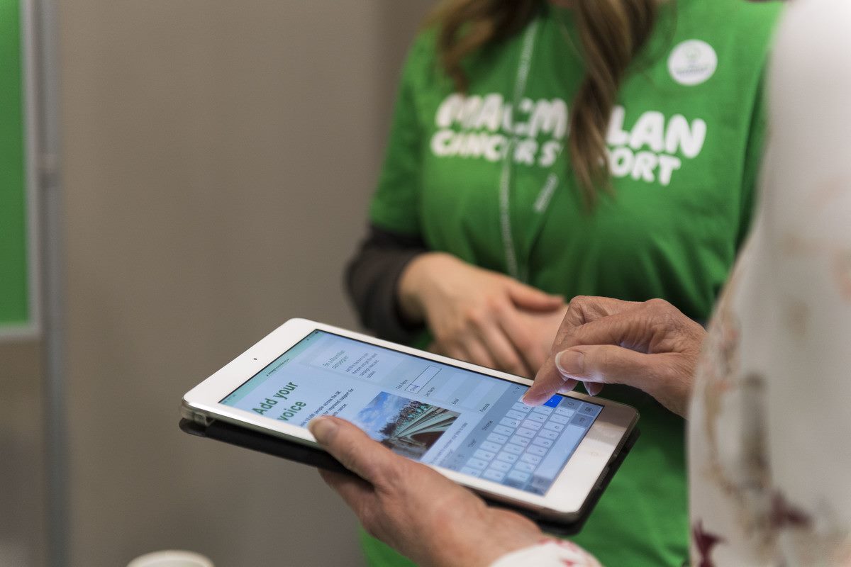 A lady browsing the Macmillan site on a tablet