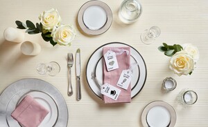 Macmillan wedding favours on a plate at a place setting on  a wedding table
