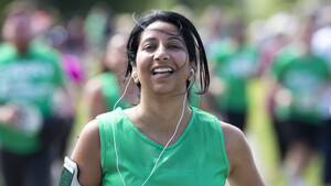 A female smiling while running as part of Run Regents Park 2017