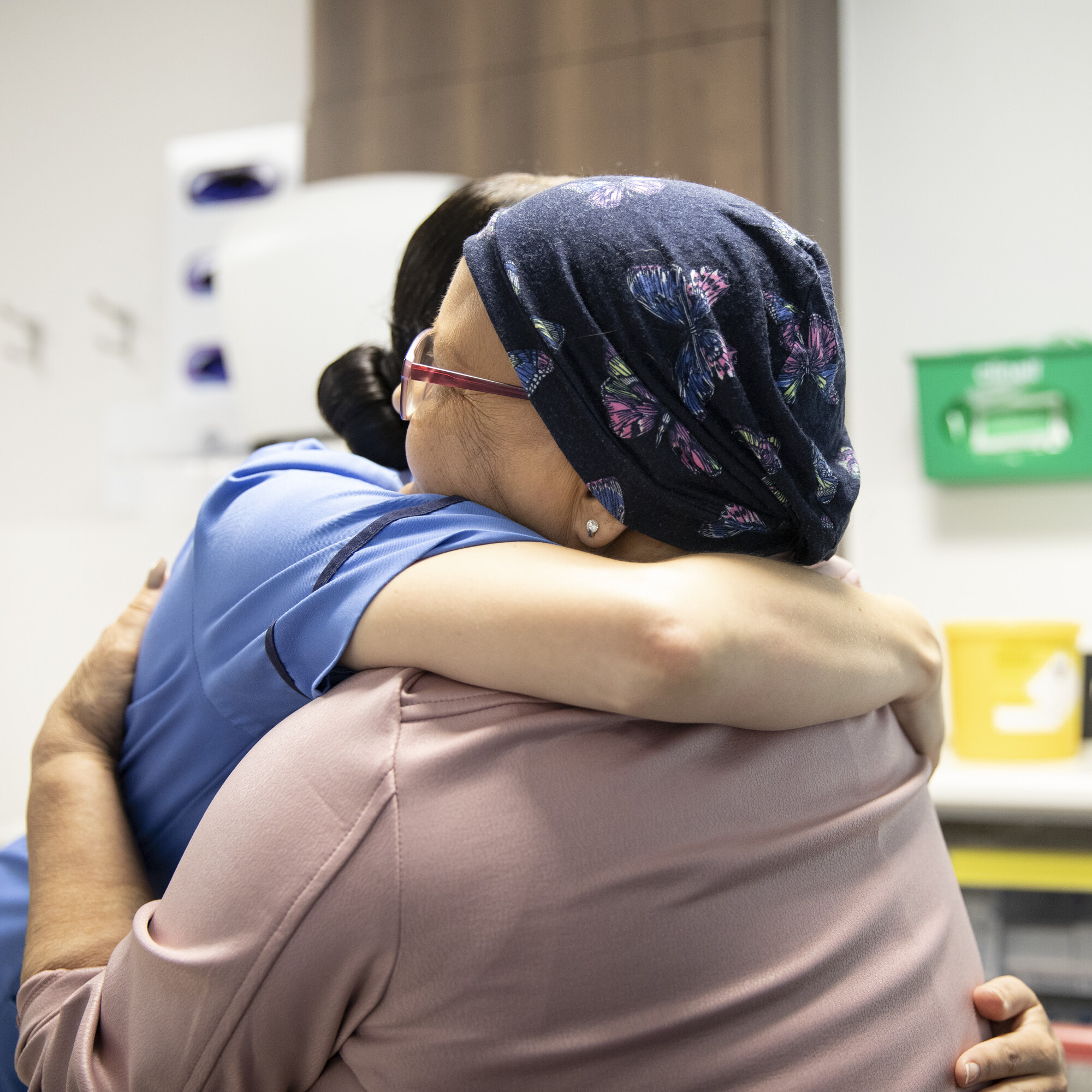 Women hugging Macmillan professional - About us