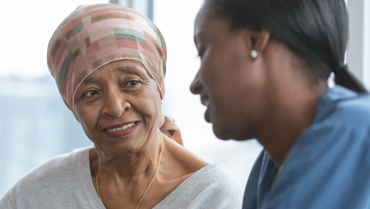 Two women looking at a phone 