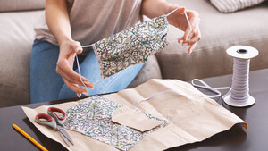 A woman crafting a face mask