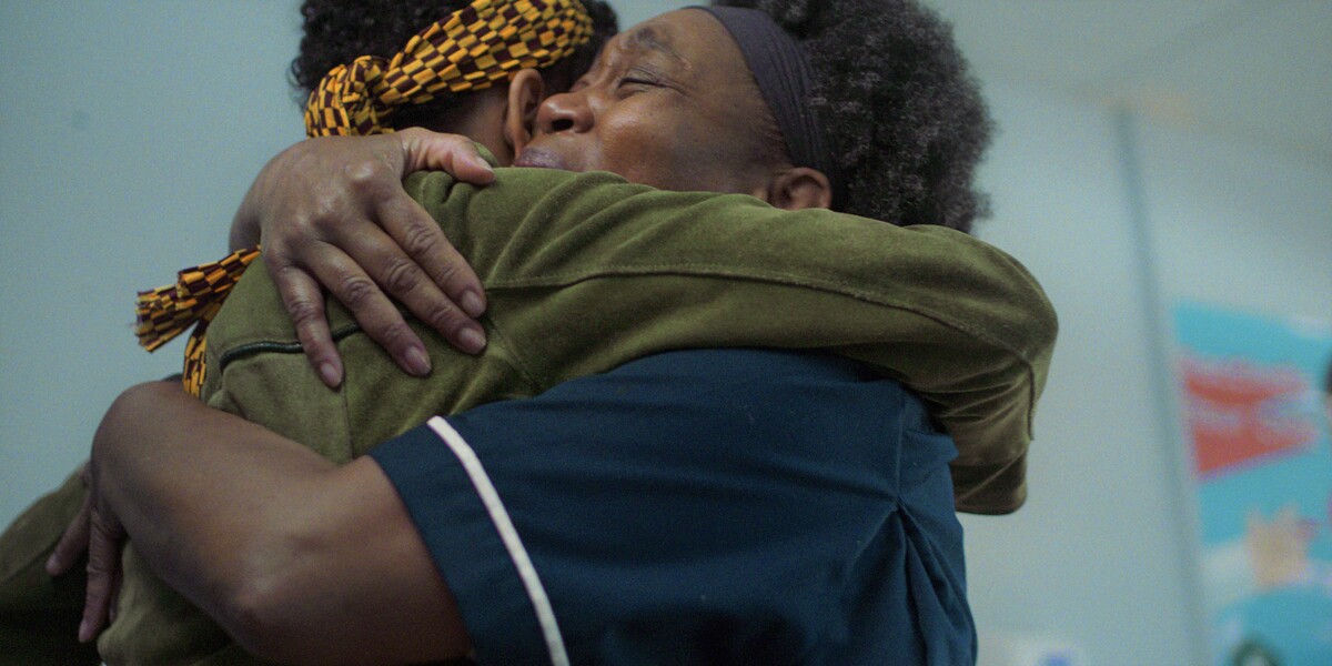 Two black women hugging