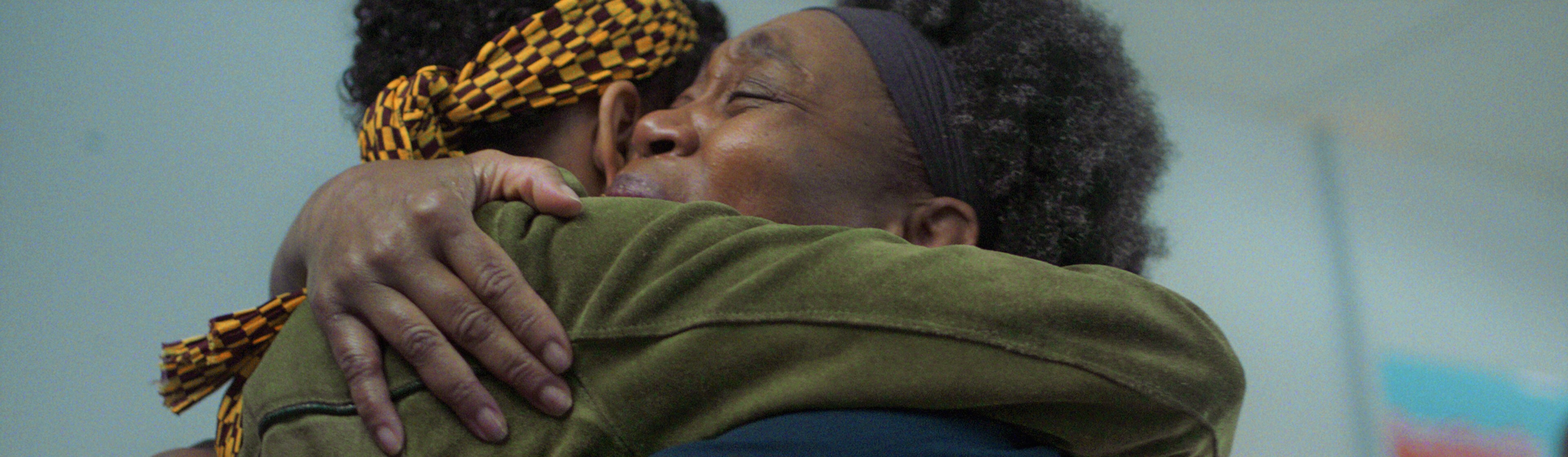 Two black women hugging