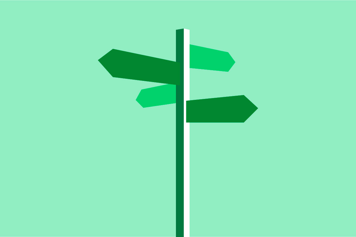A dark green signpost with four different arrows on a light green background.