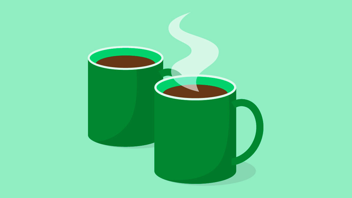 Two dark green mugs on a light green background.