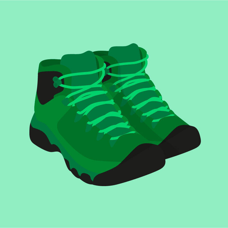 Dark green hiking boots on a light green background.