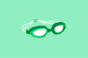 Dark green and white swimming goggles on a light green background.