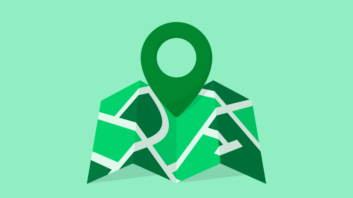 An unfolded map with a pin on a light green background.