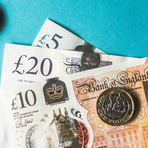 Coins and notes on a blue background