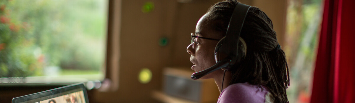 A woman at her desk on a laptop