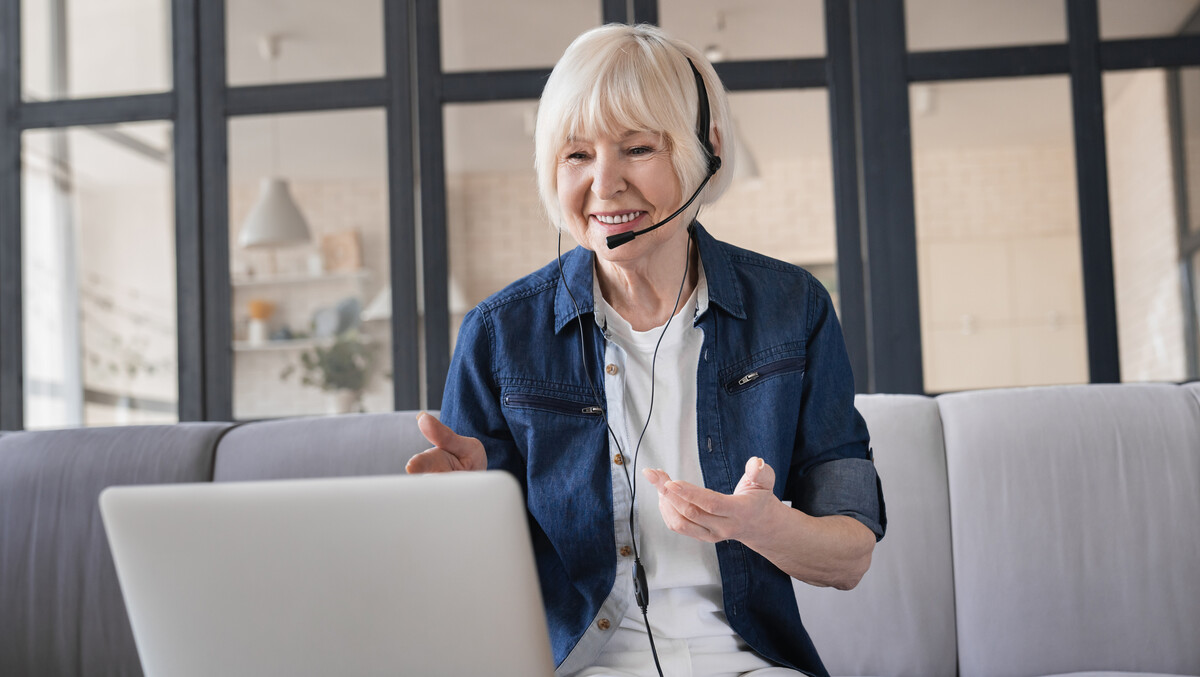 Older woman on a laptop having a virtual meeting