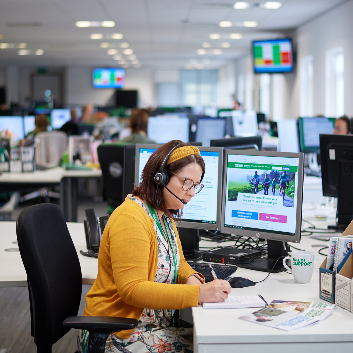 A member of our Financial Guidance team working at her desk