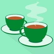 Two dark green teacups on a light green background.